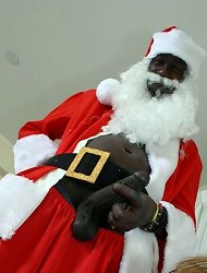 Black Santa Claus gets his 13-inch cock sucked by cute white boy on a Christmas Eve