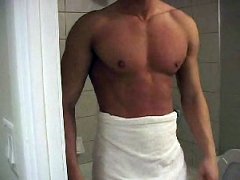 Cute muscular stud getting ready to shower